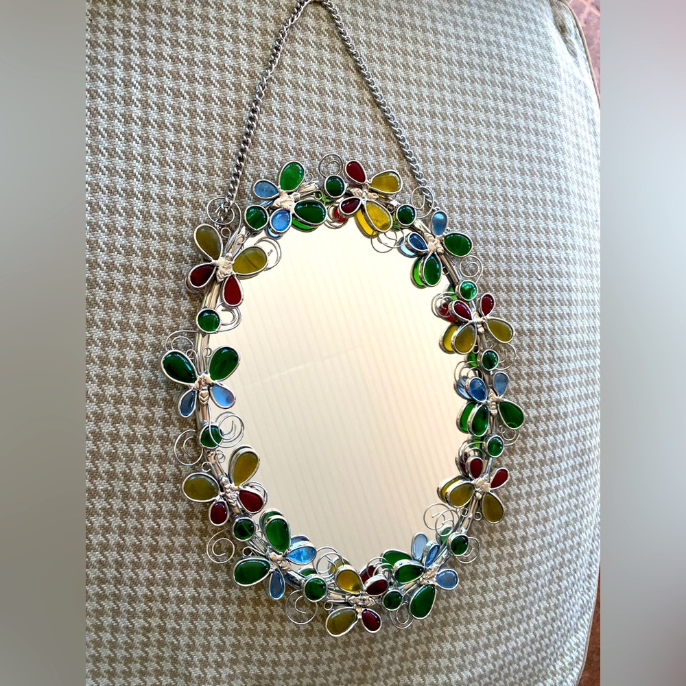 Oval mirror approximately 8” x 10” butterfly frame